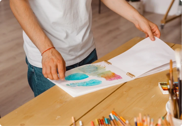 Person holding coloring book
